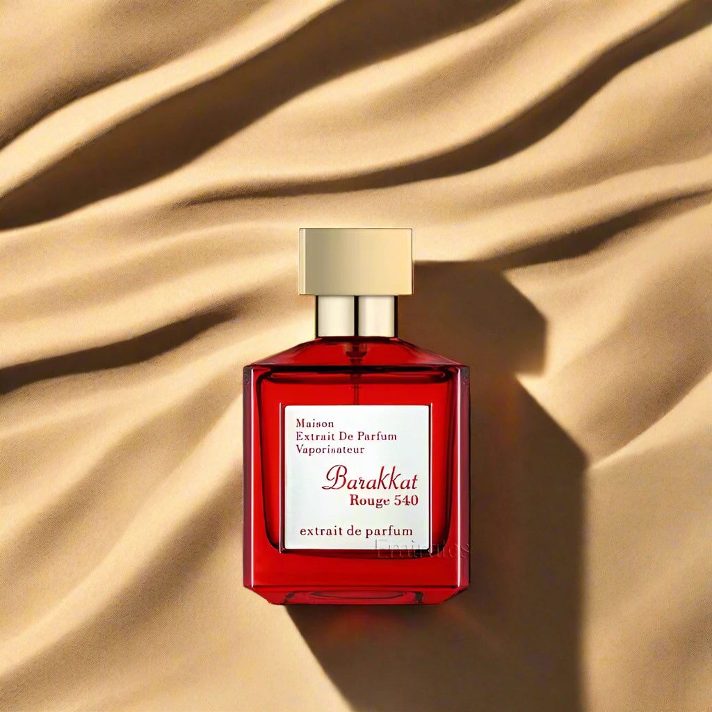 "Barakkat Rouge 540 Extrait Perfume 100ml EDP by Fragrance World - A striking red and gold bottle exuding elegance and luxury."

