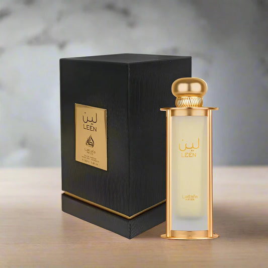 A sleek, transparent perfume bottle with a gold cap, labeled 'Jasmine Essence,' surrounded by white jasmine flowers