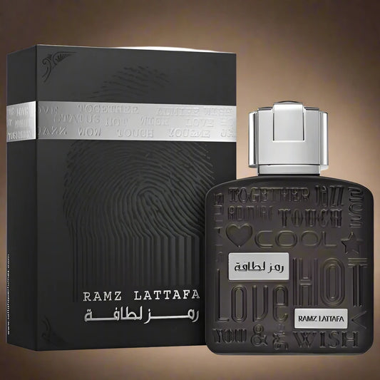 Lattafa Ramz Silver 100ml Eau de Parfum bottle with a sleek and modern design.